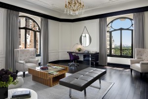 The living room with offers a Central Park view and 14 ft. ceilings